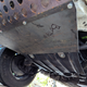 A close-up of where the new bumper ties in to the shielding under the car.